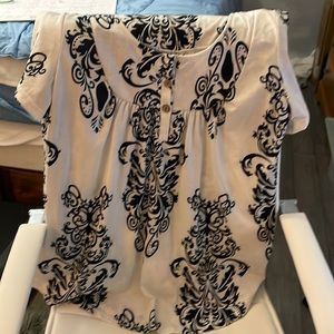 Women’s top, black and white, three buttons in the front. Like new!